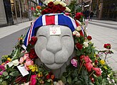 Tributes on a lion sculpture