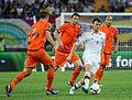 UEFA Euro 2012 match between Netherlands and Denmark. Two teams in different colored uniform.