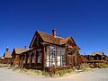 Image 1 Bodie, California Photo credit: Jon Sullivan A street corner in the ghost town of Bodie, California, named after William S. Bodey who discovered gold in the area in 1859. By 1880 Bodie had a population of nearly 10,000. Bodie is also notable for a hydroelectric plant built 13 miles (21 km) away in 1893, one of the first transmissions of electricity over long distance. The town was declared a National Historic Landmark in 1961 and has been in a state of arrested decay ever since. More selected pictures