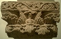 Indo-Corinthian capital from Surkh Kotal, with central Buddha figure.