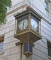 Whittier Village Clock, mounted on the building's corner.