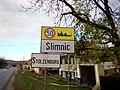 Inscripție bilingvă româno-germană la intrarea dintr-un sat din Transilvania (Slimnic)