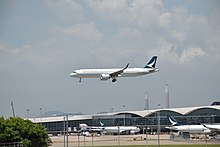 A Cathay Pacific Airbus A321neo landing. All Cathay Pacific A321neo's have an Airbus Cabin Flex configuration.