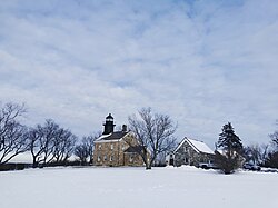 The Old Field Point Light, which, along with the adjacent Keeper's Cottage, serves as the village's Village Hall complex.