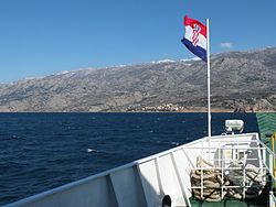 Ferry between Prizna (mainland) and the Island of Pag, Prizna in the background