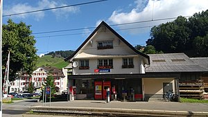 Three-story building with gabled roof