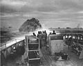 Coast Guardsmen on the deck of the U.S. Coast Guard Cutter Spencer watch the explosion of a depth charge which blasted U-175's hope of breaking into the center of a large convoy.