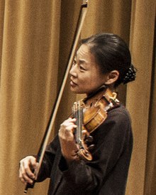 Midori instructing a student during rehearsal in 2013