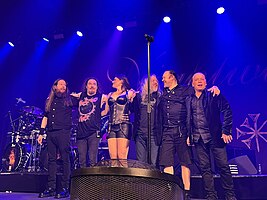 Nightwish after a performance in Toronto in May 2022; (L–R): Jukka Koskinen, Tuomas Holopainen, Floor Jansen, Troy Donockley, Kai Hahto, and Emppu Vuorinen.