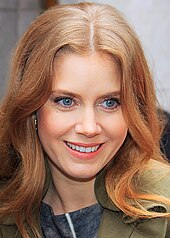 A close-up shot of a smiling Amy Adams