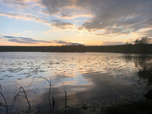 A photo of Auchencrieff Loch during a sunset.