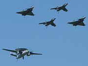 Two Super Étendard, two Rafale fighters and an E-2C Hawkeye at the 2010s French Naval Aviation Centenary Airshow