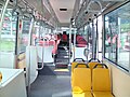 Image 33Interior of a wheelchair-accessible transit bus, with bucket seats and smart-card readers at the exit. (from Transit bus)