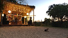 Casual Stage area with lights, two guys setting up