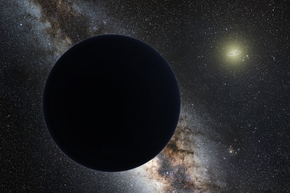 Planet Nine is shown in shadow against the Milky Way with the Sun in the distance. It is depicted as a large, black sphere. Dim planet on a dark background with many stars