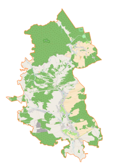 Mapa konturowa gminy Rakszawa, blisko centrum na dole znajduje się punkt z opisem „Rakszawa”