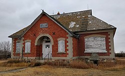 Abandoned brick schoolhouse