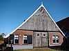 Grote Saksische hoeve met hoog pannen zadeldak nu Museum Frerikshuus