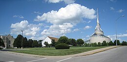 Road junction with grassy lawn and three churches