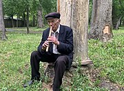 A shepherd from Polissia playing dudka-vykrutka, a local variety of sopilka