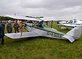 A drooped elevator, nearly touching the grass, on the horizontal stabilizer of this Currie Wot biplane