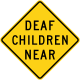 Deaf children near sign, California.