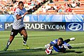 Image 2 Goalkeeper (football) Photo credit: Nick Wiebe Congo national football team goalkeeper Destin Onka (right) prevents Austrian forward Rubin Okotie (left) from scoring a goal at the 2007 FIFA U-20 World Cup. In association football, the goalkeeper is the only player who is permitted to touch the ball with his hands or arms in open play. More selected pictures