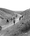 Soldiers marching through the Kasserine Pass