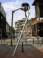 Image 37Statue of a tripod from The War of the Worlds in Woking, England, the hometown of author H. G. Wells. The book is a seminal depiction of a conflict between mankind and an extraterrestrial race. (from Culture of the United Kingdom)