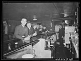 Dick's images of Western Pennsylvania mining towns, including this one of a bar in Gilberton, focus on everyday activities, household living and items, and the mines themselves.