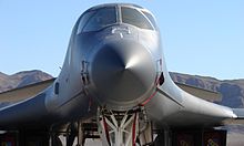 A front view of a B-1B's nose showing its small canards