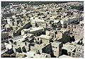 The attached images depict the neighborhoods and houses of Qatif Castle prior to their removal. Notably, some roofs remain unroofed, a local practice known as A'arsh.