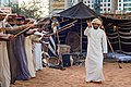 Image 15A band performs the Ayyala, which is a cultural dance derived from Arab tribes sword battles. (from Culture of the United Arab Emirates)