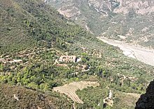 Greek Orthodox Monastery of the Holy Archangels (Pammegiston Taxiarchon), Aigialeia, Greece. View from the rock of the hermitage of Saint Leontius. The Honorable Body of Saint Leontius is kept inside the monastery church.