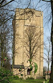 Brick built tower with wooden door at base