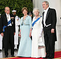 President George W. Bush and First Lady Laura Bush with Queen Elizabeth II and Prince Philip, Duke of Edinburgh at the beginning of an official dinner at the White House, 2007.