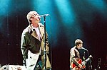 Liam and Noel Gallagher of Oasis performing in San Diego on September 18, 2005.