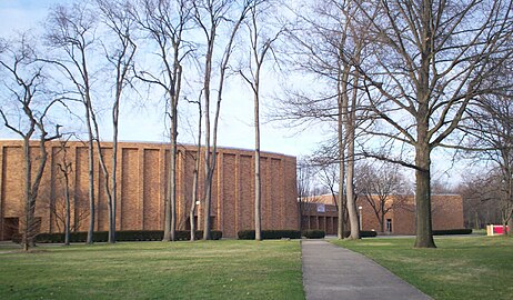 Front view showing the outer wall of the auditorium and the lobby. This side of the building faces North Mantua Street.