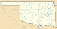 Mapa konturowa Oklahomy, u góry nieco na prawo znajduje się punkt z opisem „Marshall”