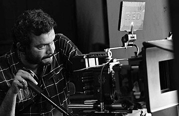 Cinematographer Vinod Illampally behind RED movie camera