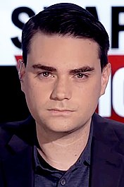 a man with dark hair wearing a color-matching yarmulke