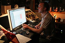 A man sitting in front of a computer