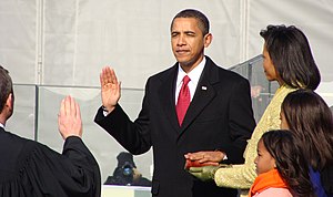 Barack and Michelle Obama, their children, and Chief Justice John Roberts.