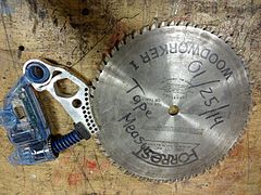 Cartridge and 10-inch, 36-tooth saw blade taken from a Saw Stop table saw after activation of safety mechanism