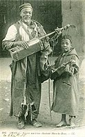 Oran, Algeria, early 20th century. The geumbri is also an instrument of Morocco, used in Gnawa ceremonies.