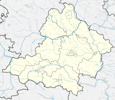 Mapa konturowa powiatu jędrzejowskiego, blisko centrum na dole znajduje się punkt z opisem „Mierzyn”