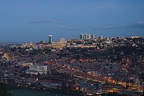 Panorama photograph of Kigali, including the towers of the CBD in the distance