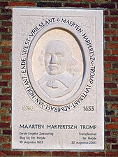 Plaquette in de muur van de N-H kerk