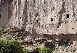 A Remains of multistory dwelling built into a volcanic tuff wall, Bandelier National Monument, New Mexico