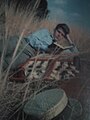 A model reads a book in a 1968 de Evia portfolio photograph.